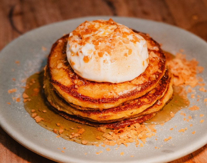 Corn pancakes topped with palm syrup and whipped creme fraiche