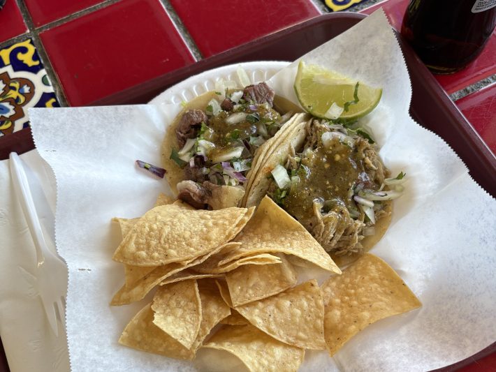 a plate of tacos and chips