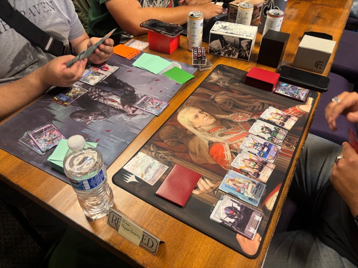 a shot of players playing a fantasy card game