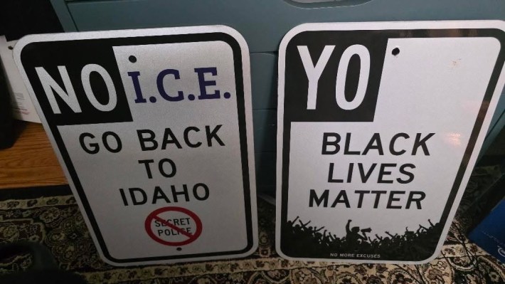 in the style of street parking signs: "NO I.C.E. GO BACK TO IDAHO" and "YO BLACK LIVES MATTER"