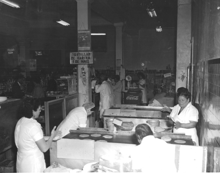 Workers in a restaurant making tortillas