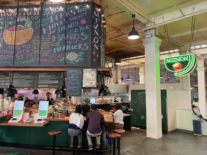 customers sitting at a restaurant bar