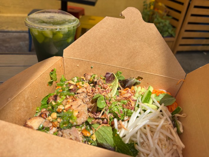 a box of Vietnamese rice noodles, toppings, and chicken