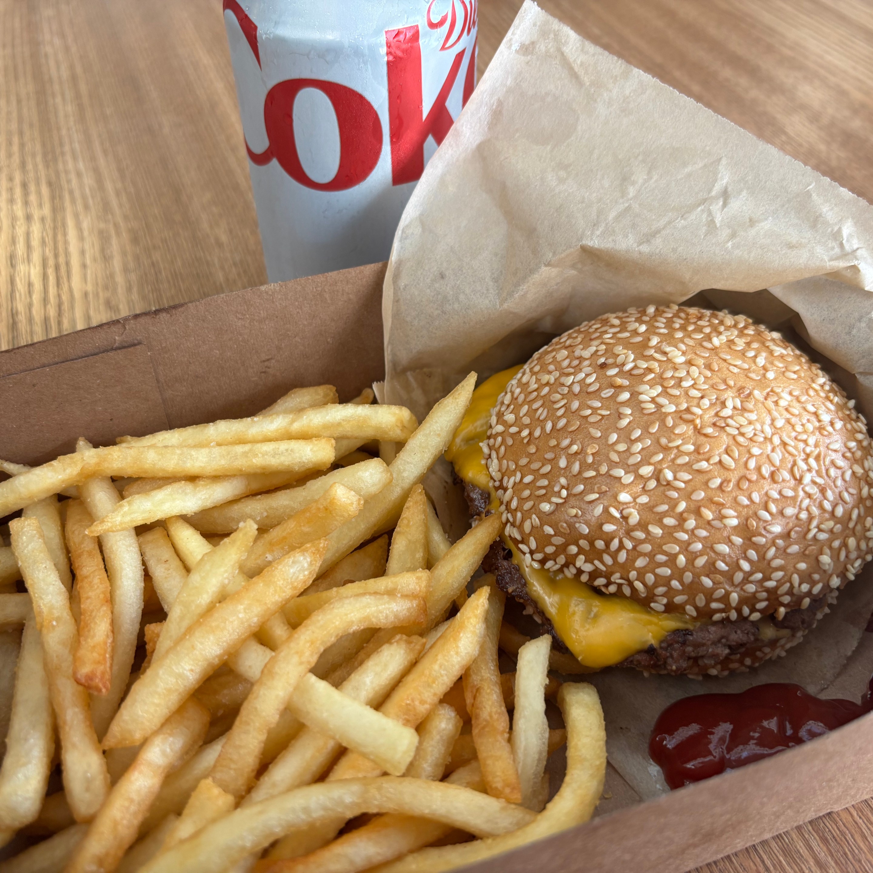fries, burger, and diet coke can