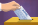 an illustrated hand paces a check from AIPAC into a ballot box