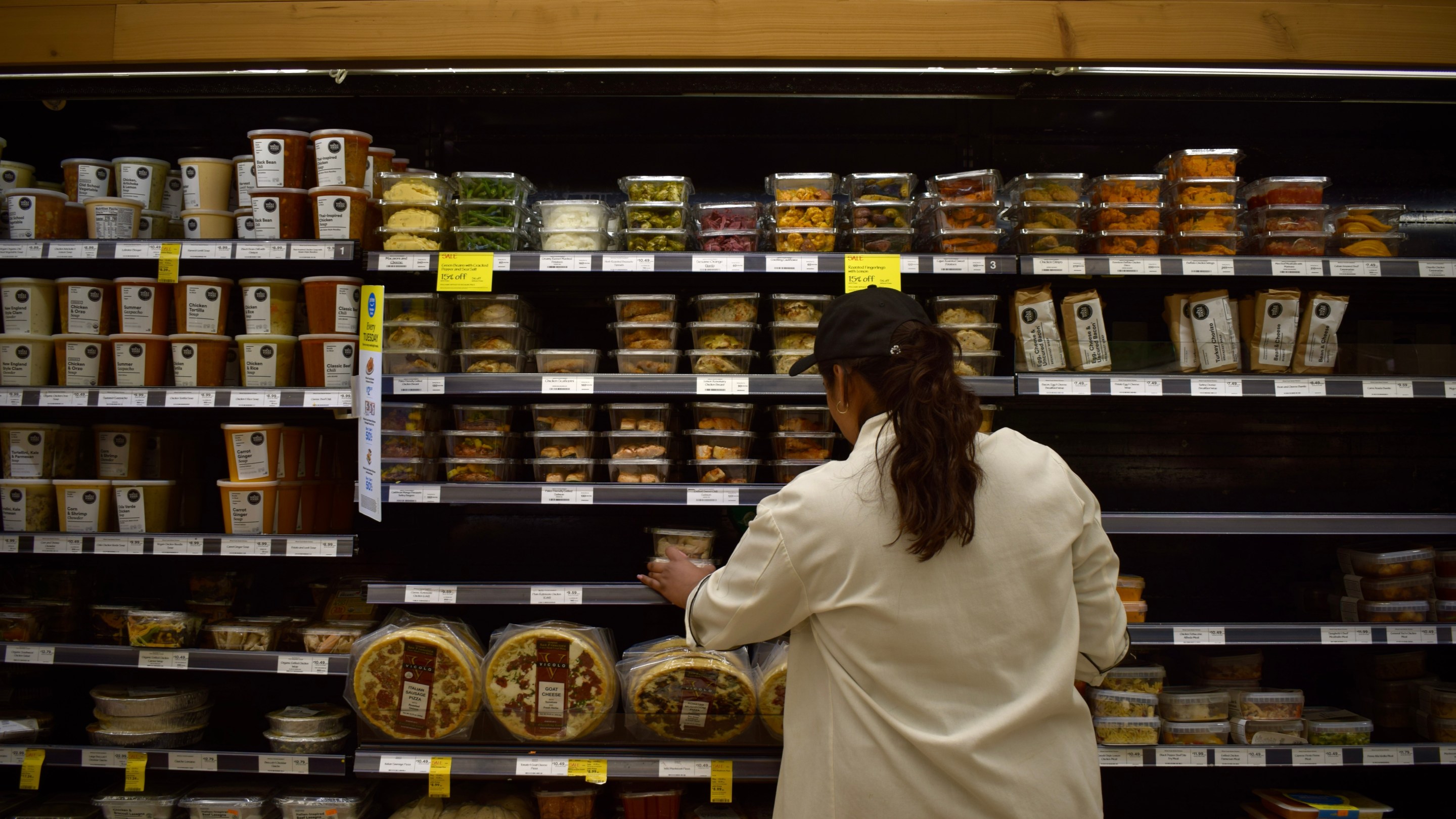 a young woman shops in a grocery store