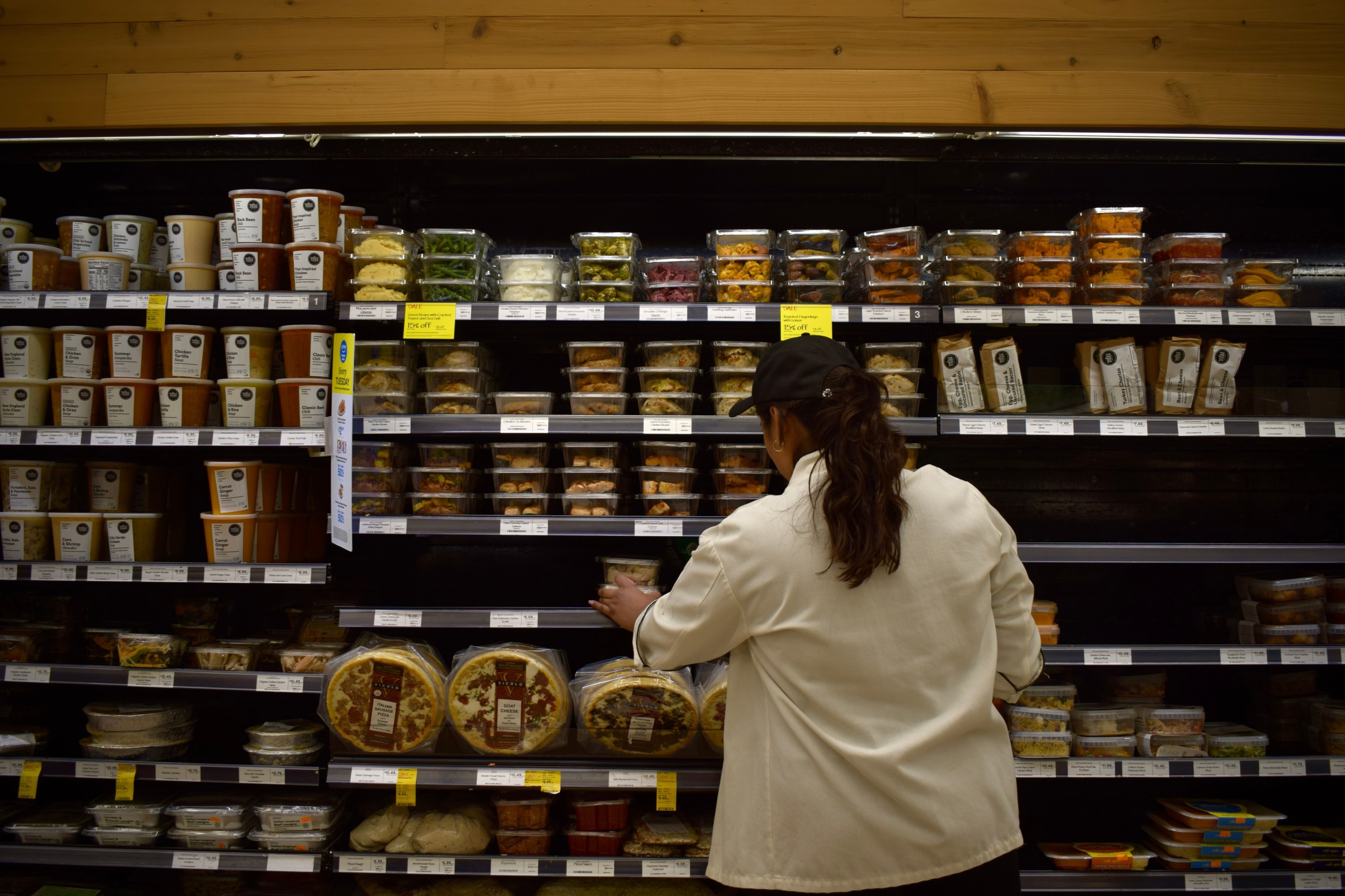 a young woman shops in a grocery store