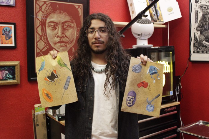 a portrait of a man holding flash sheets