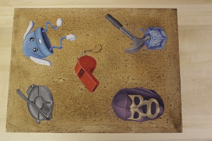 a flash sheet showing a luchador mask, red whistle, tortilla press, child's blue bunny hat, and a hammer breaking an ice cube