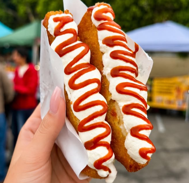 Nuvem’s cream-stuffed milk toast with squiggles of bright red jam on the top