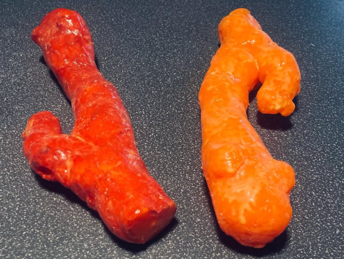 two vibrator wands made to appear like Cheetos