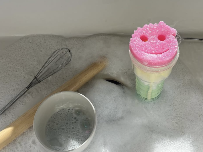 a soapy sink with dishes and a Fleshlight utilizing a Scrub Mommy sponge
