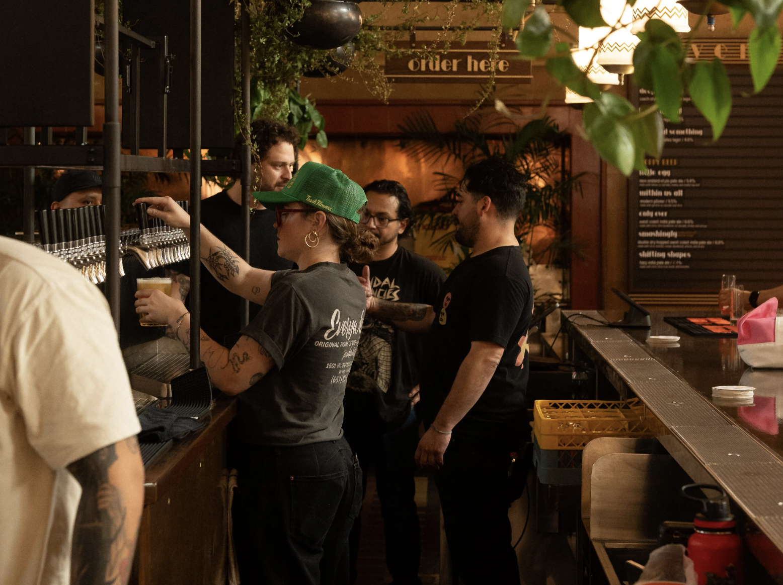 bartenders behind a bar