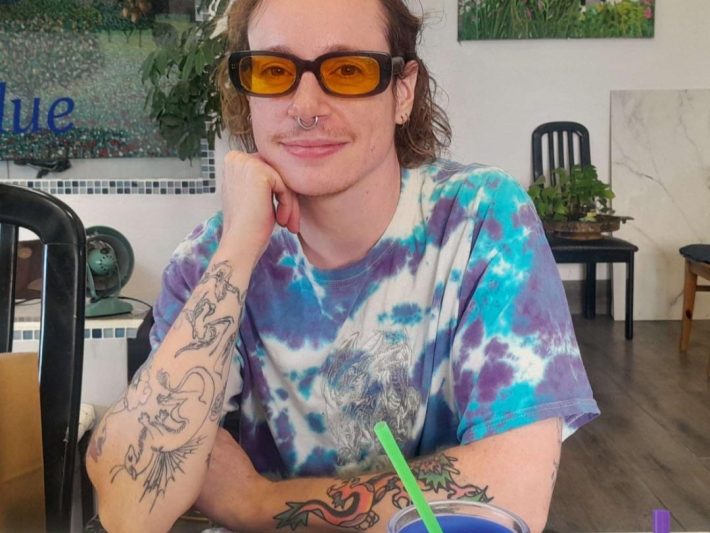 a person in sunglasses pose for a portrait