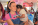 A woman known as Ms. Rachel holds a child, who puts their head on her shoulder while holding a toy truck