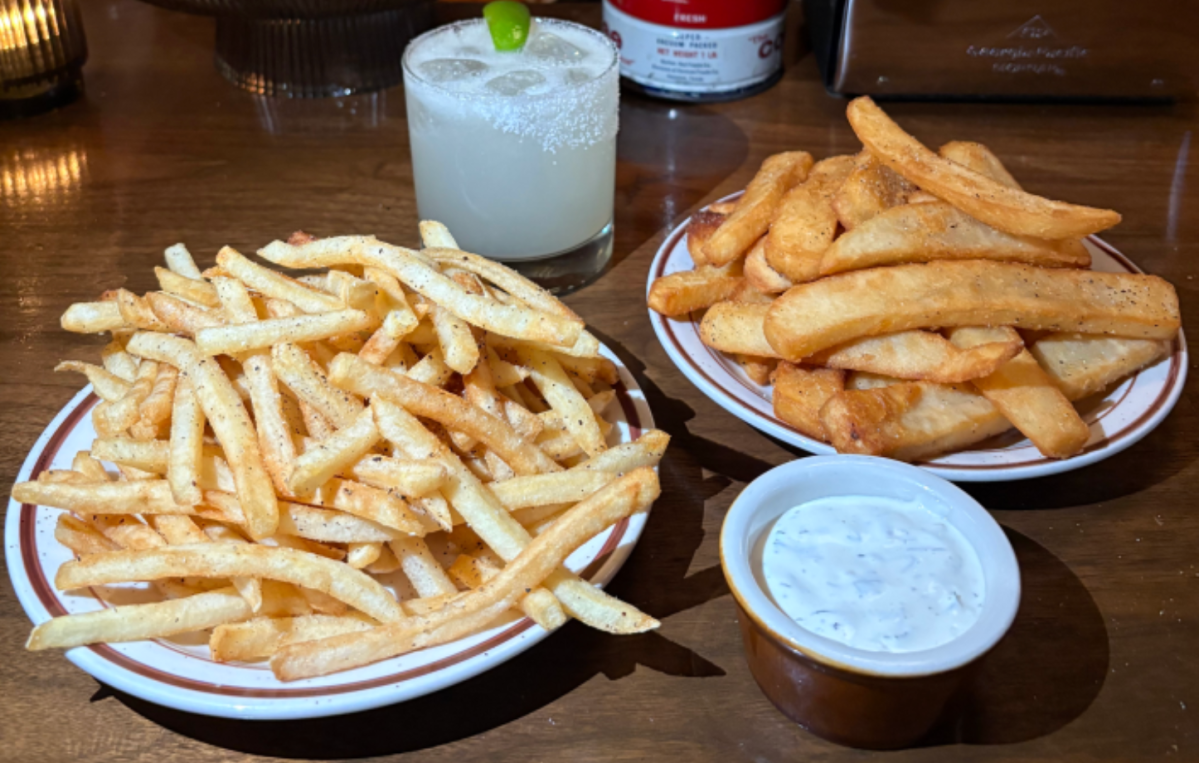 a plate of thin fries next to a plate of thick fries