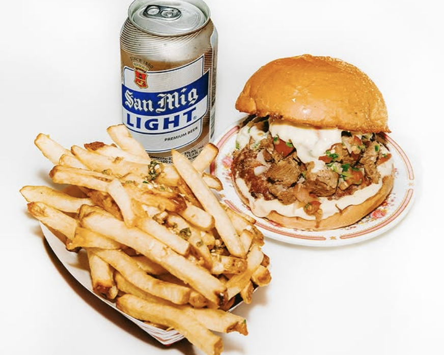 a photo of fries, burger, and beer