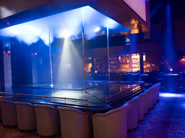 an empty stage at a gentlemen's club