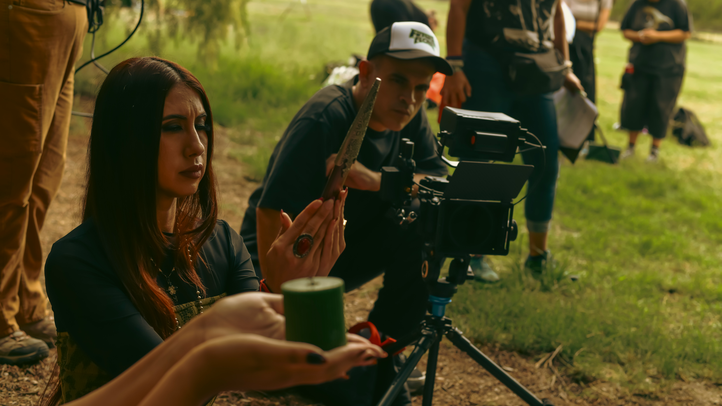 a woman with a candle being filmed