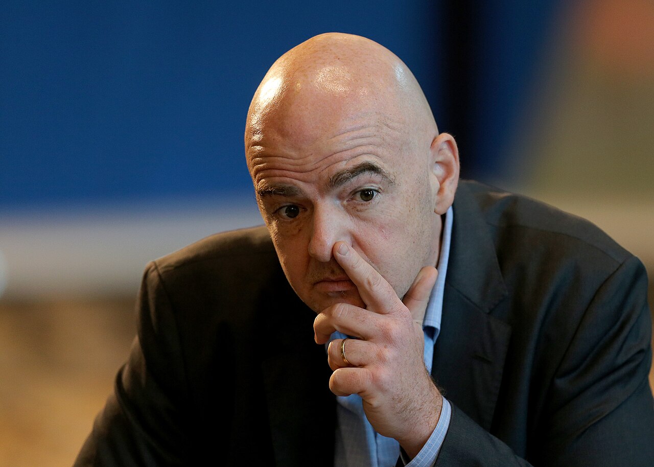 a bald man in a suit