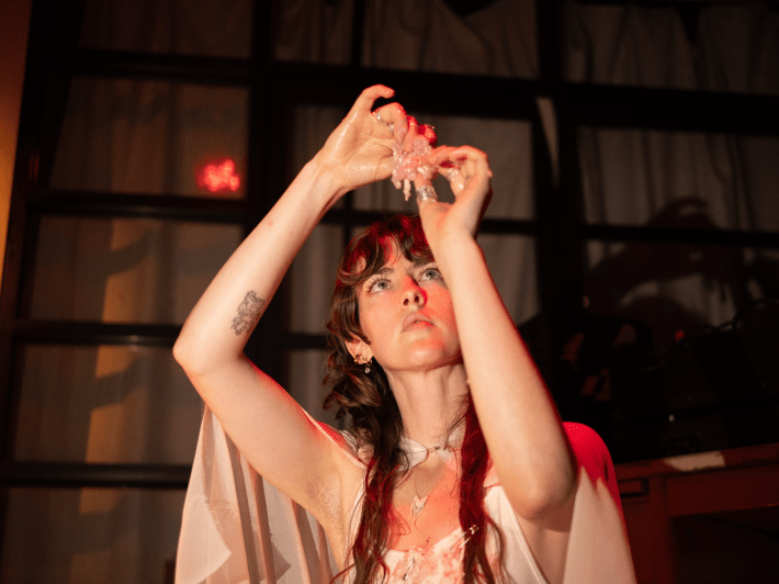 a performer prepares animal brains for pinning