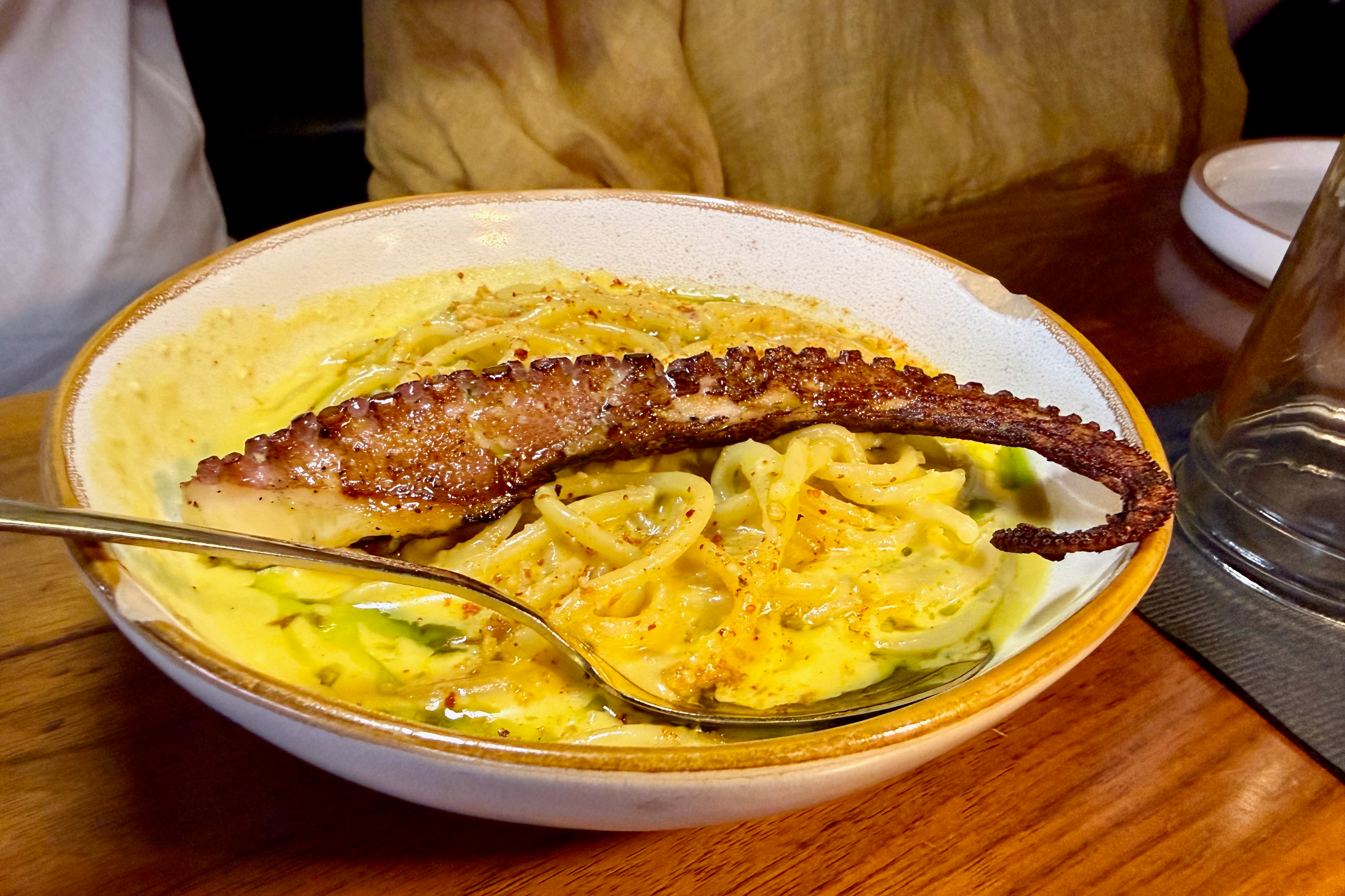 pasta with an octopus tentaacle on it