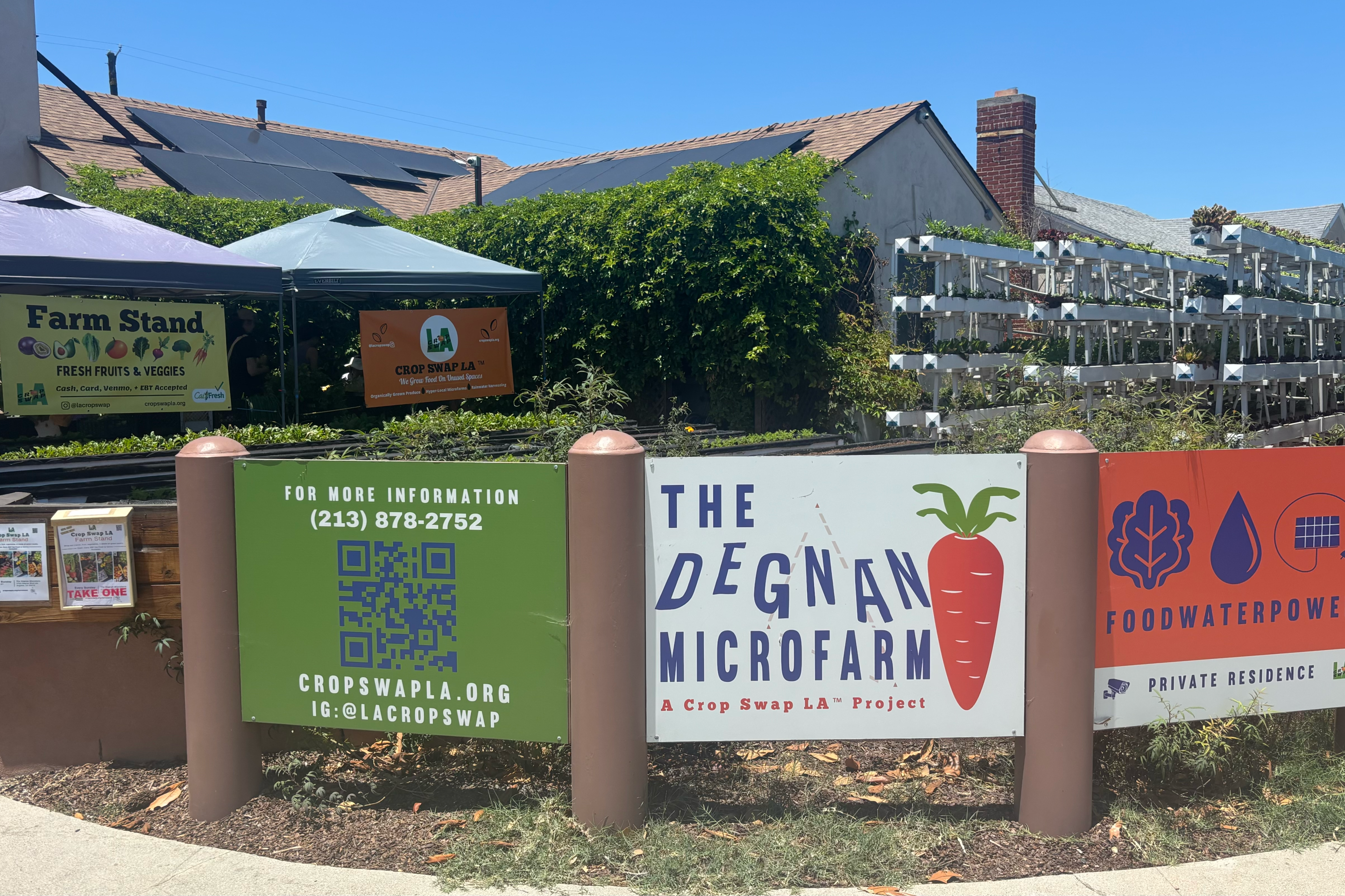 signs outside a farm and garden