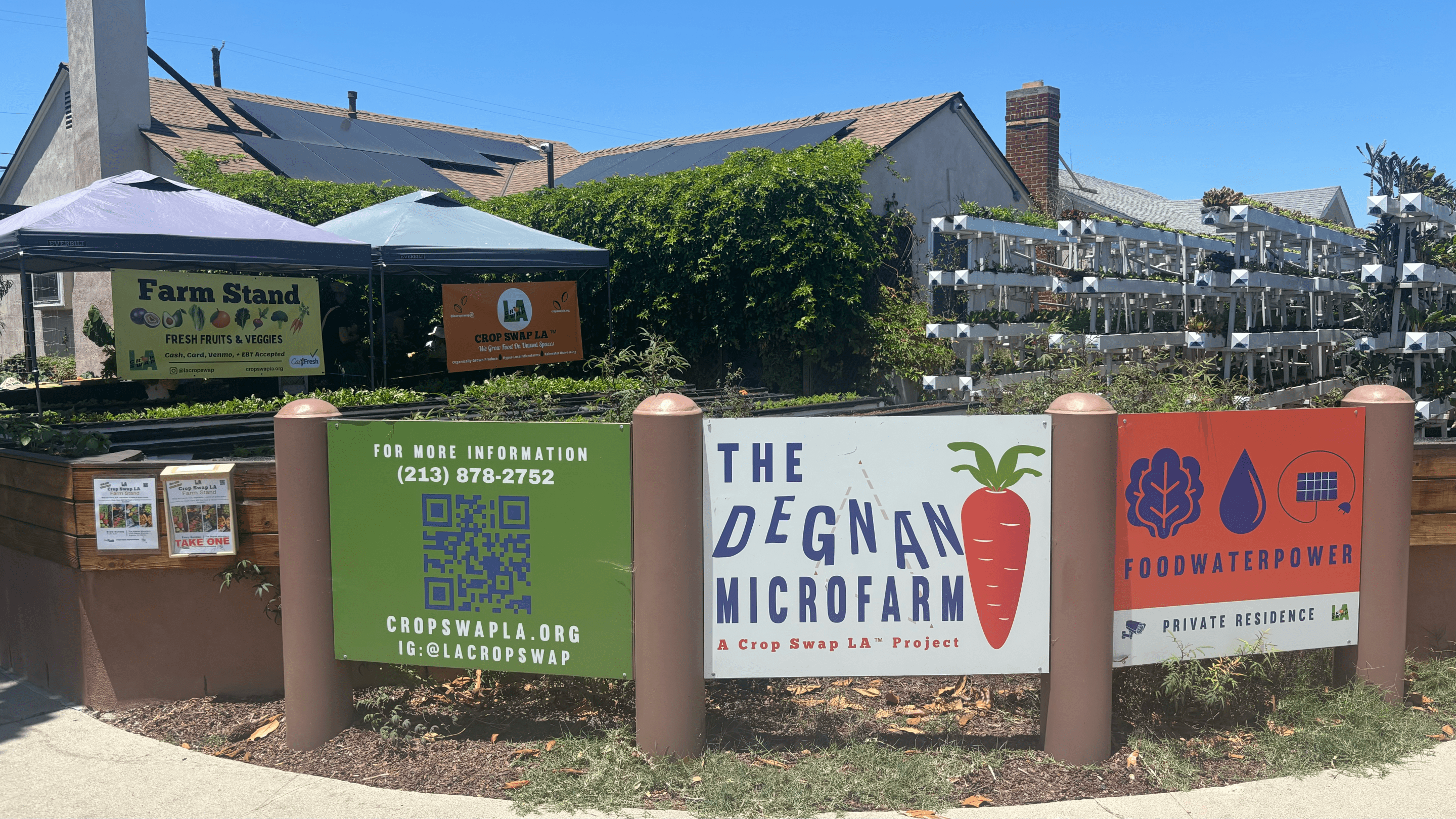 signs outside a farm and garden