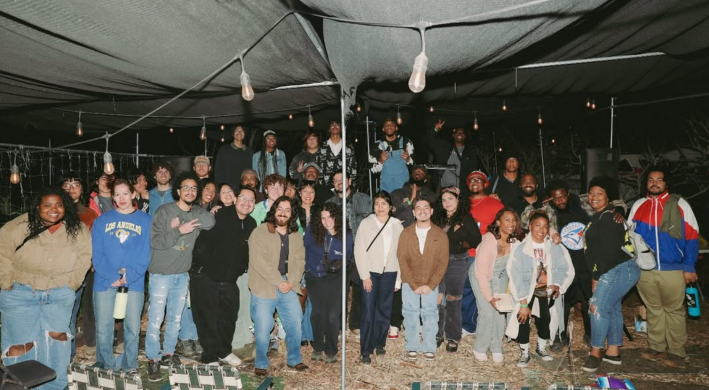a crowd of people posing at an event