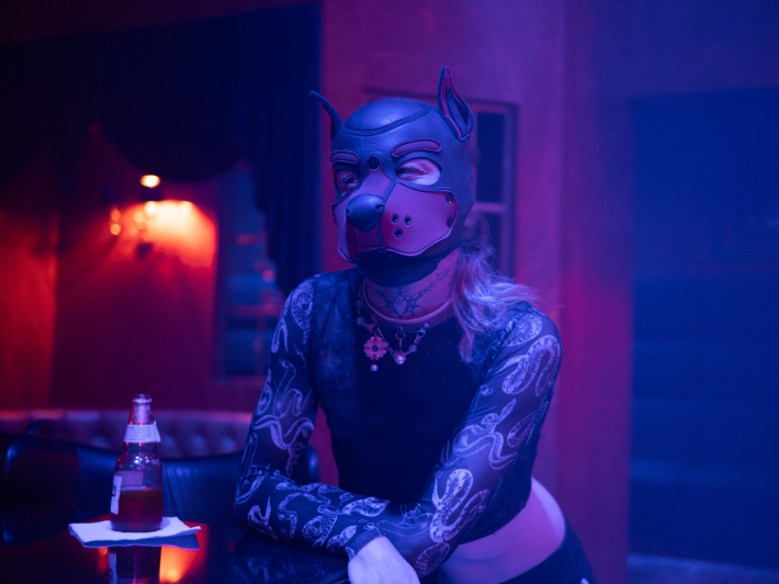 someone in a leather puppy mask