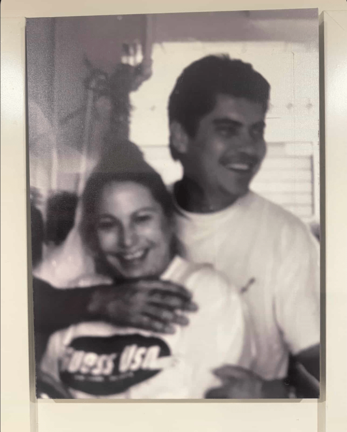 a black and white photo of a husband and wife smiling
