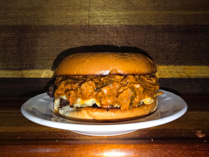 a smoked Guinness chili burger on a white plate