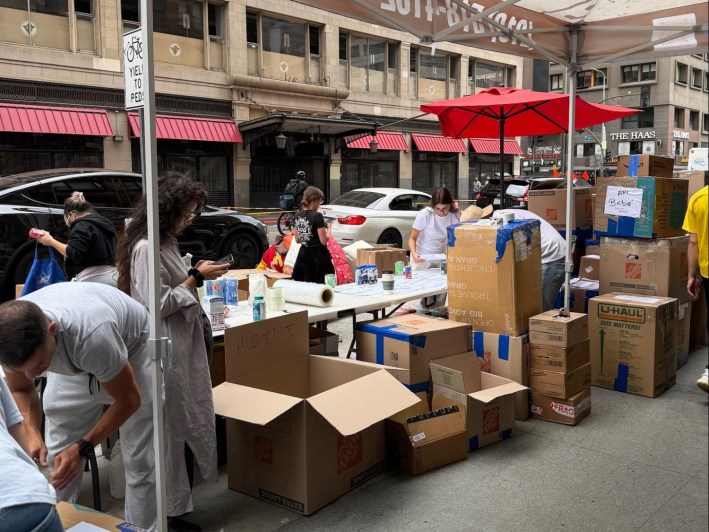 people at an outdoors donation center