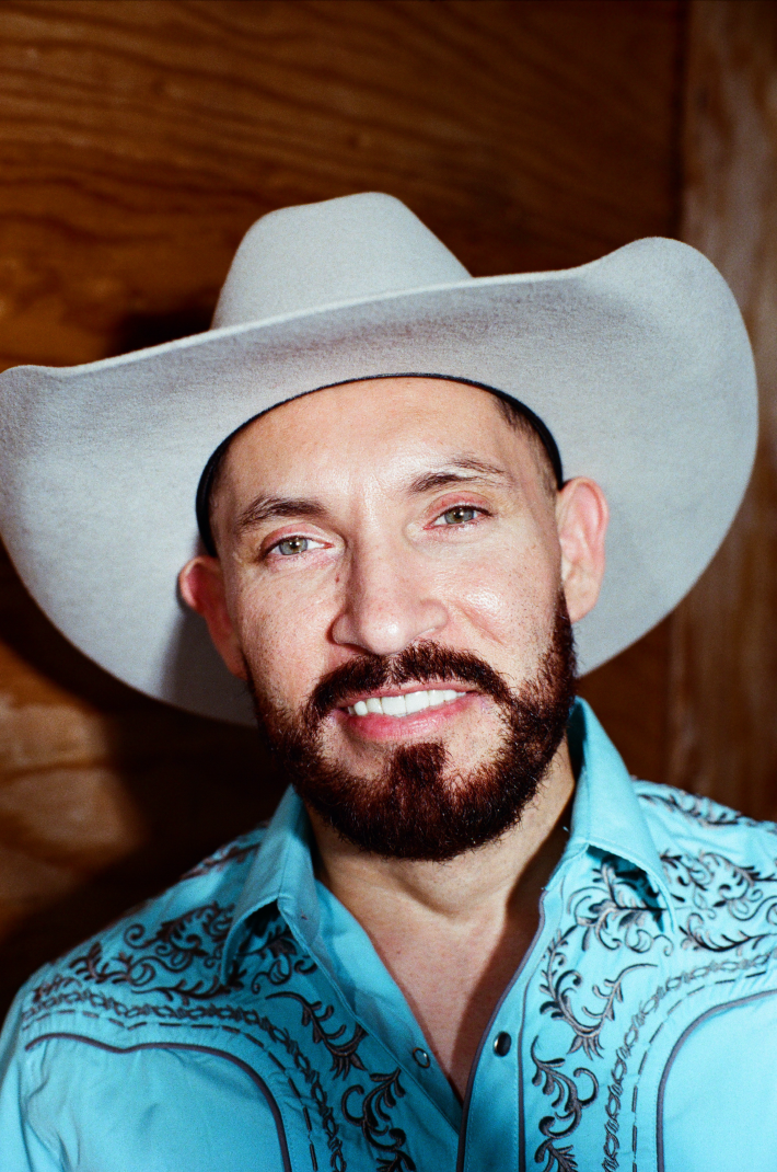 a man with a beard and mustache wearing a cowboy hat