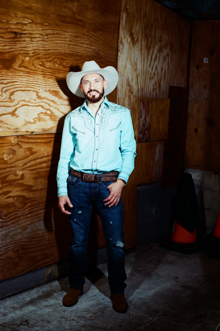 a man with a beard and mustache wearing a cowboy hat