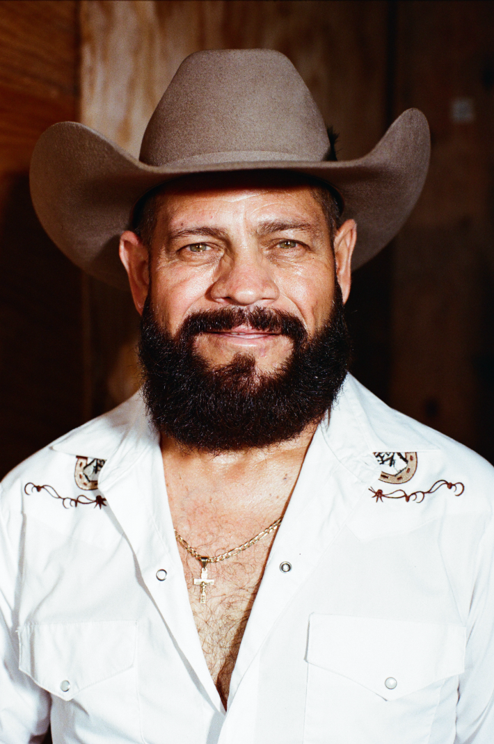 a man with a beard and cowboy hat