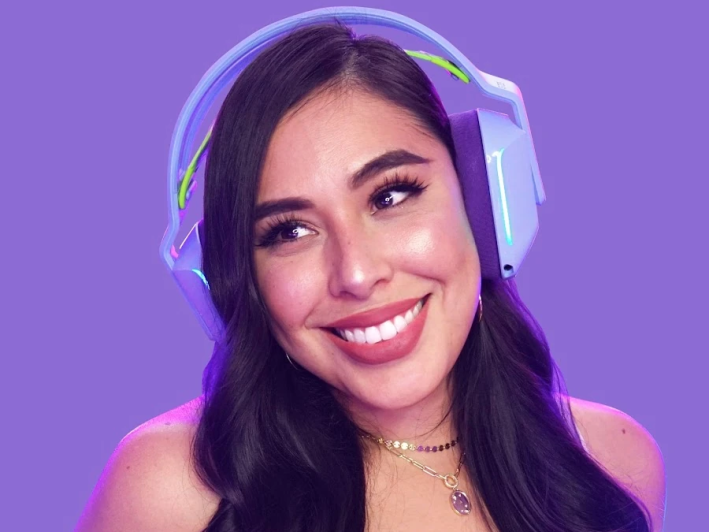 a woman in headphones smiling