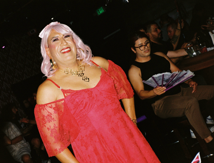 a person with long pink hair and a pink dress