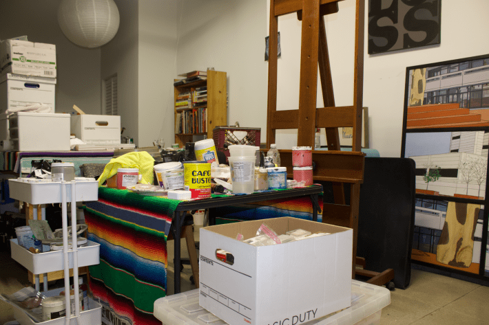 an artist's garage with art materials