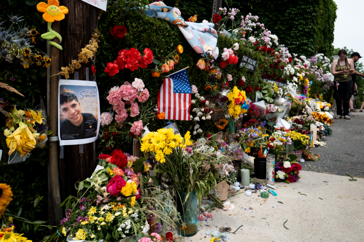 A sidewalk memorial for Joan Sebastian Guerrero including his portrait which is hung