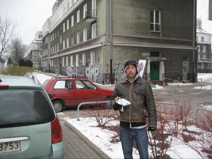a man outside in the snow in Warsaw