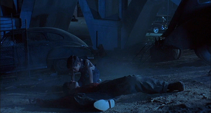 Young Jimmy (Jonathan Hernandez) crouches over the body of his older brother Chucho (Esai Morales).