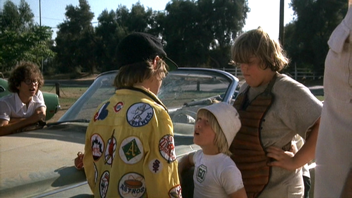 Ogilvie (Alfred Lutter), left center, confronts Tanner Boyle (Chris Barnes), right center