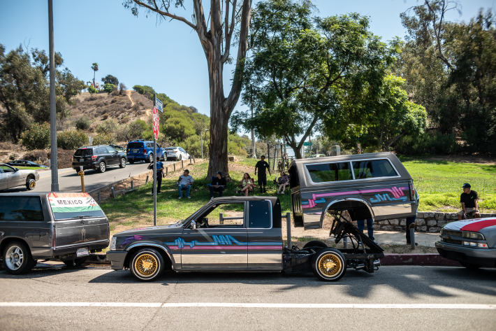 a car with an elevated back and trunk