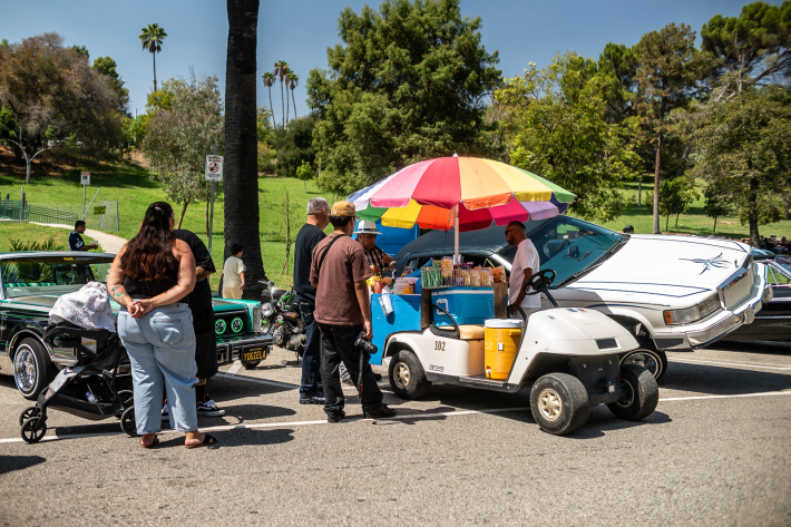 a street vendor at a classic car show