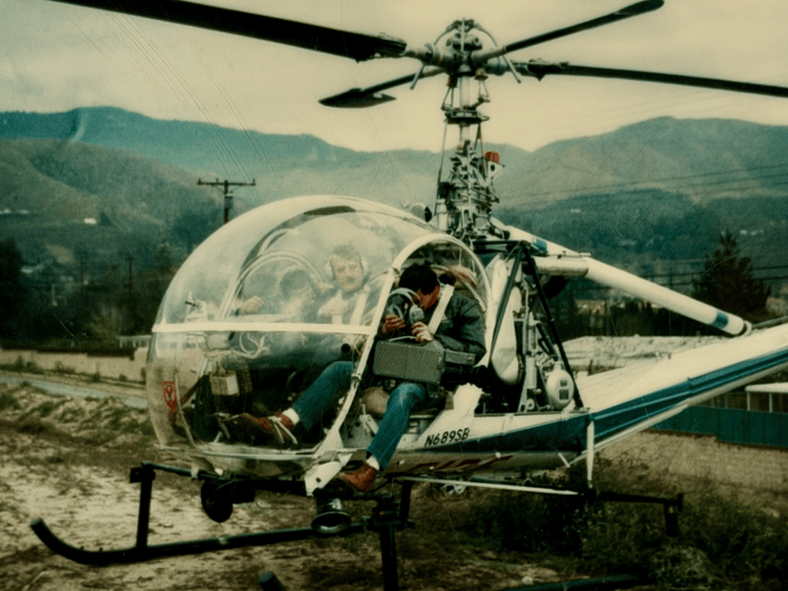a young man in a helicopter