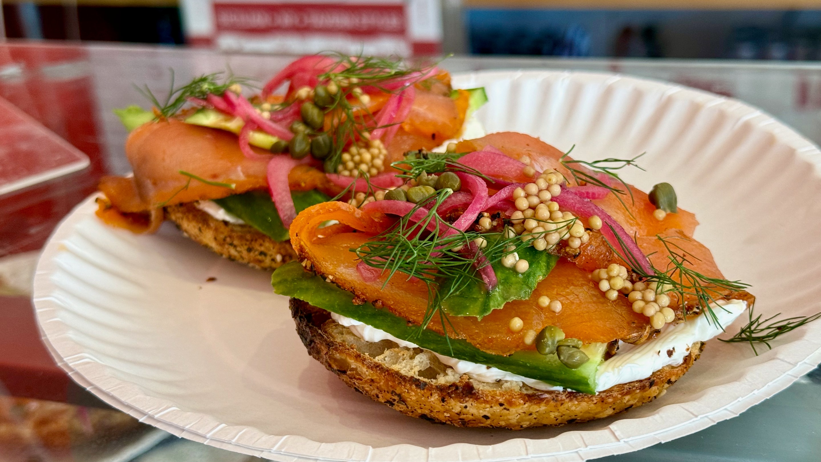 Smoked salmon bagel on a poppy seed bagel.