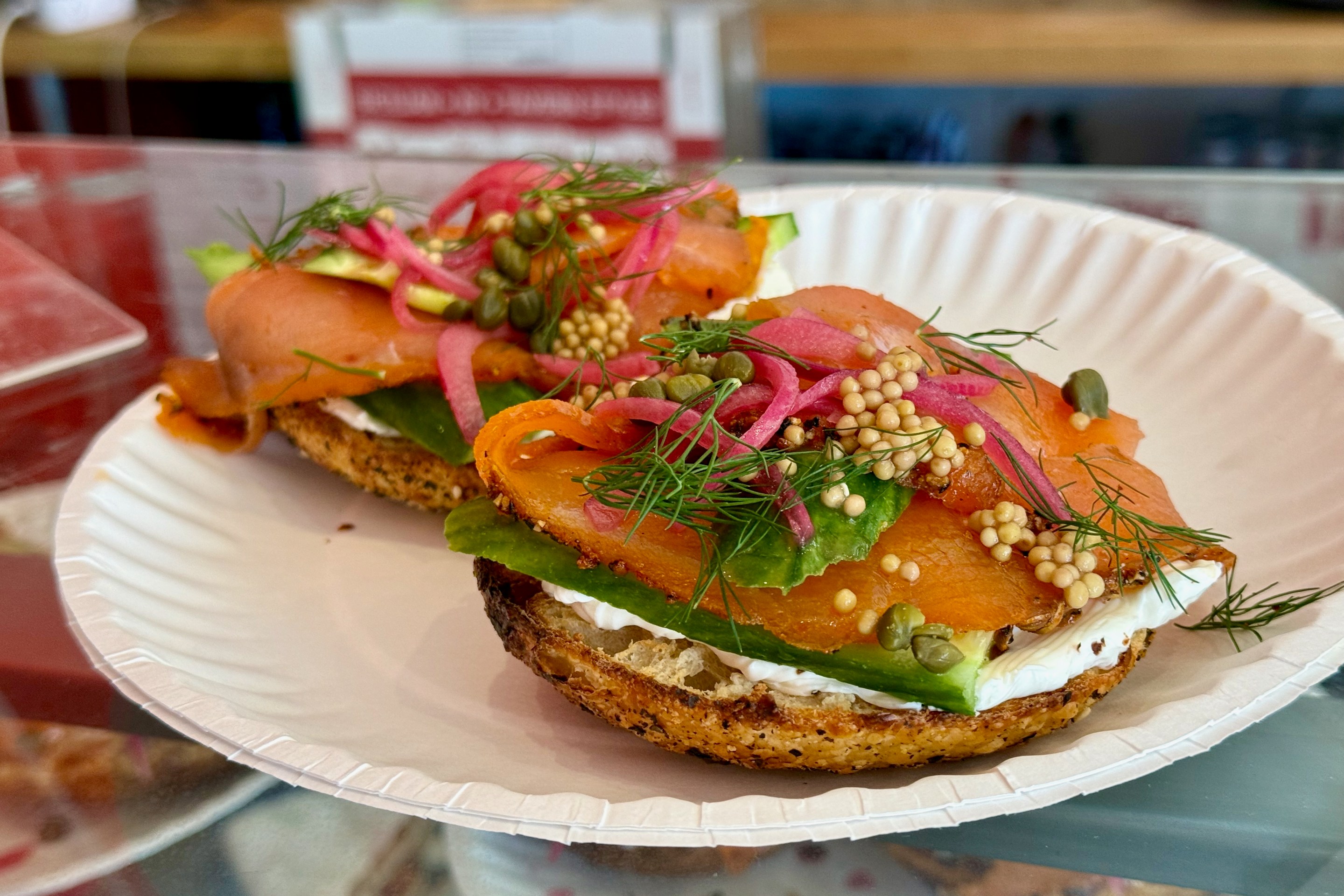 Smoked salmon bagel on a poppy seed bagel.