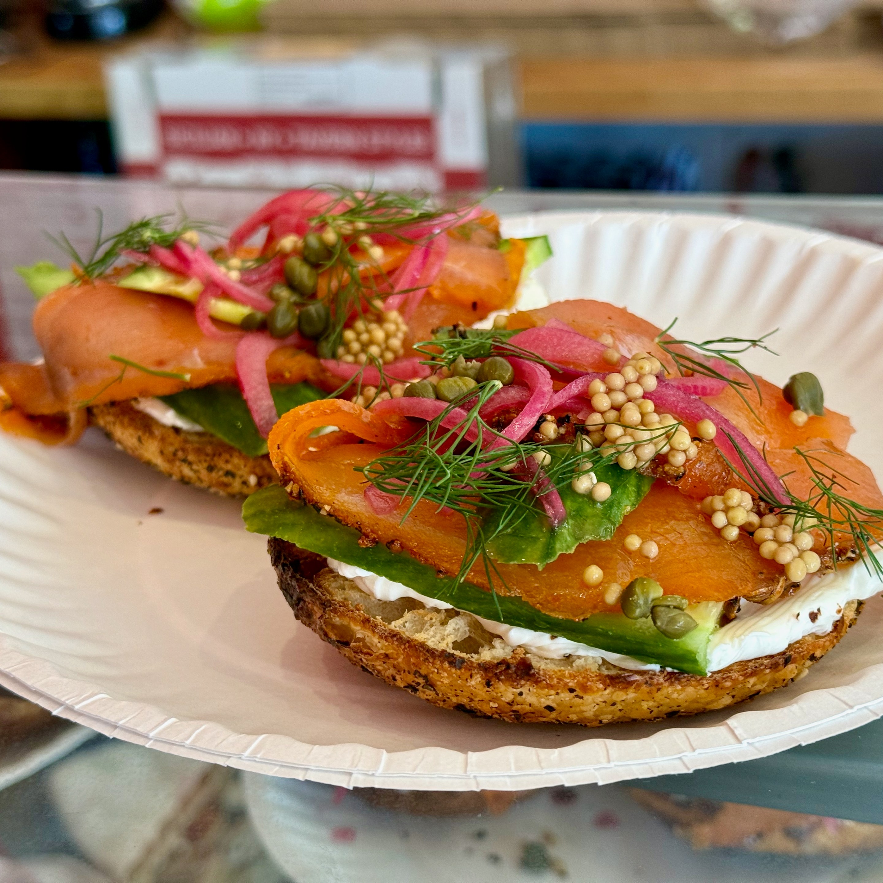 Smoked salmon bagel on a poppy seed bagel.