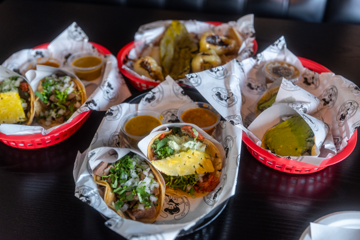 three baskets of tacos